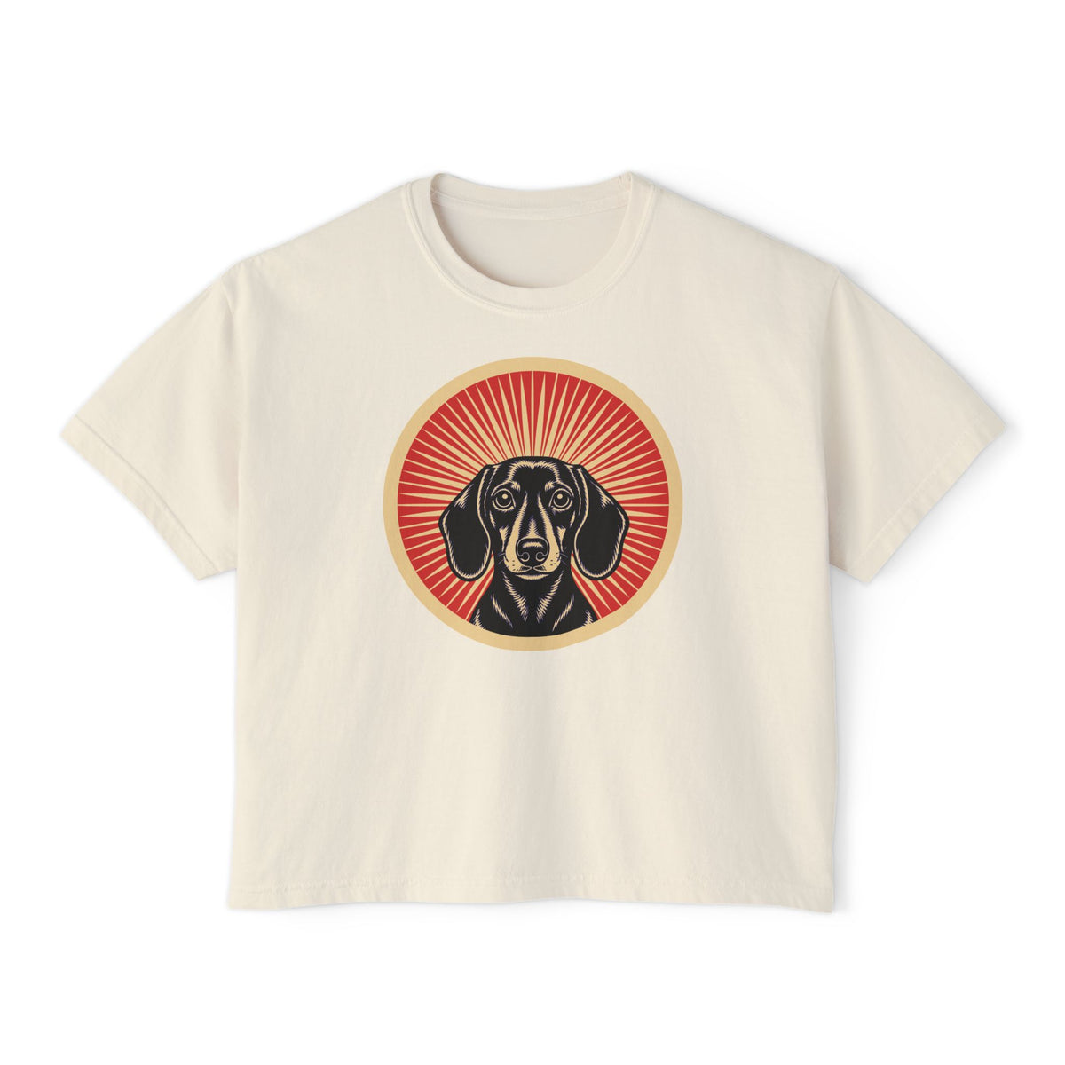 Dachshund badge art in a ring of red rays on a boxy tee