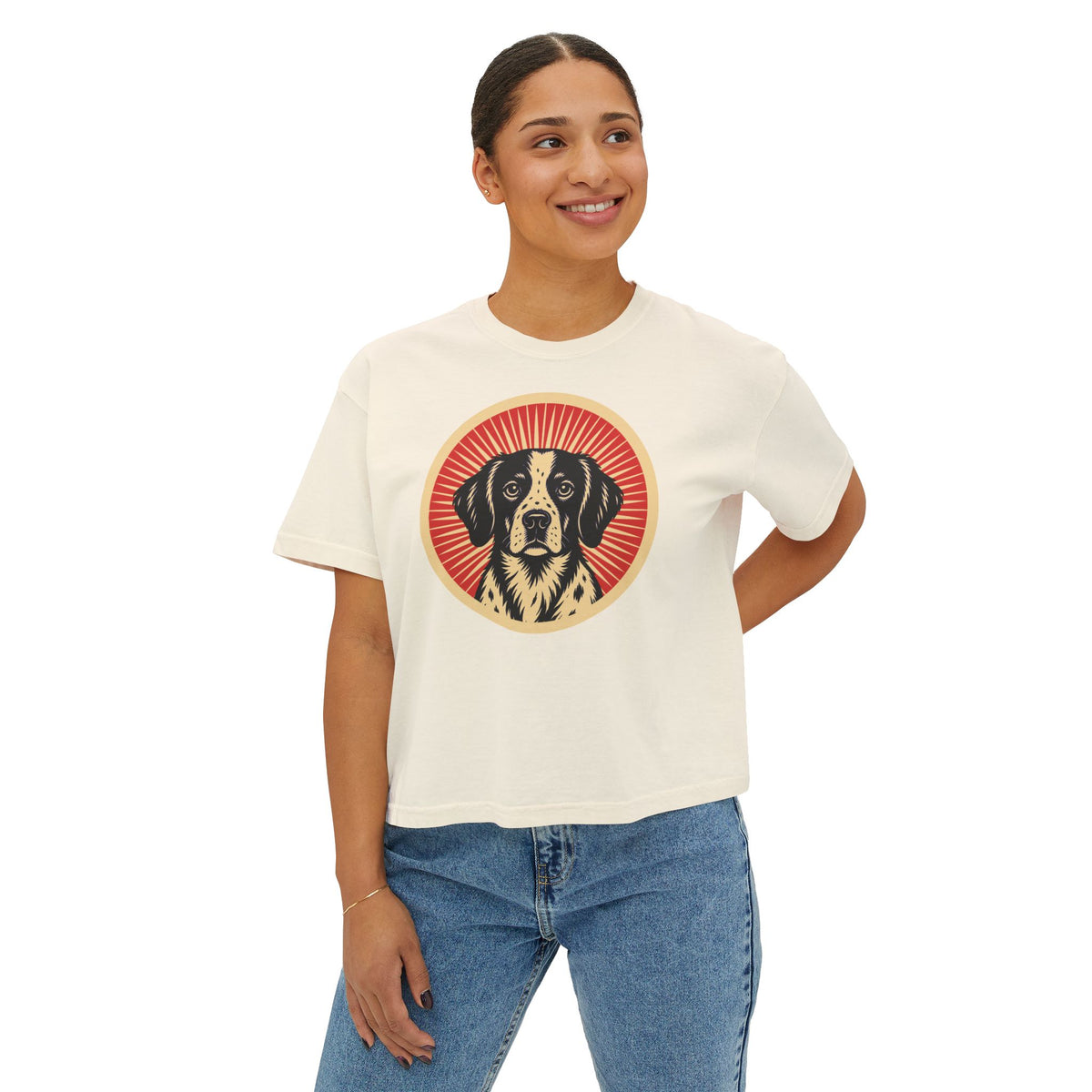 Brittany badge art in a ring of red rays on a boxy tee