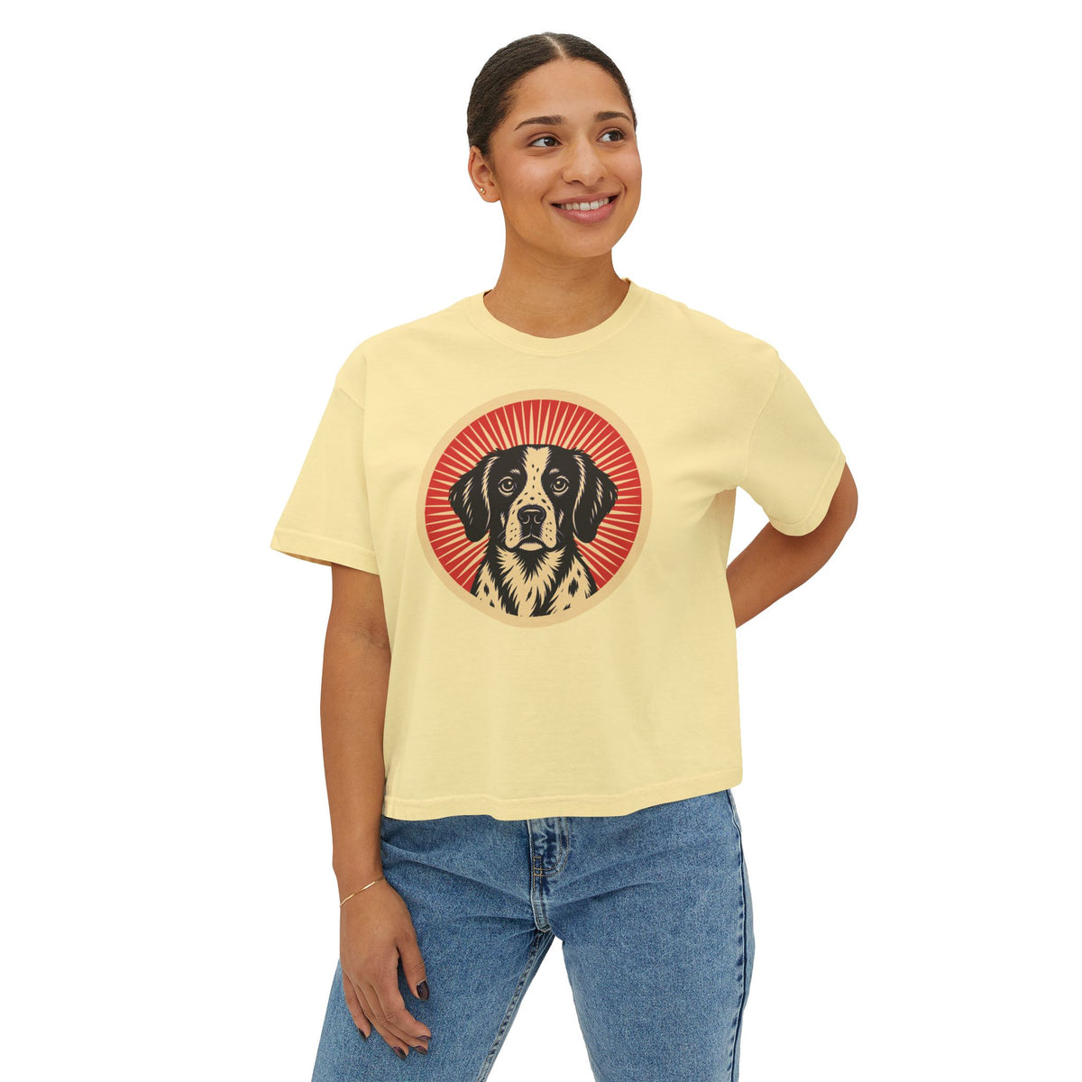 Brittany badge art in a ring of red rays on a boxy tee
